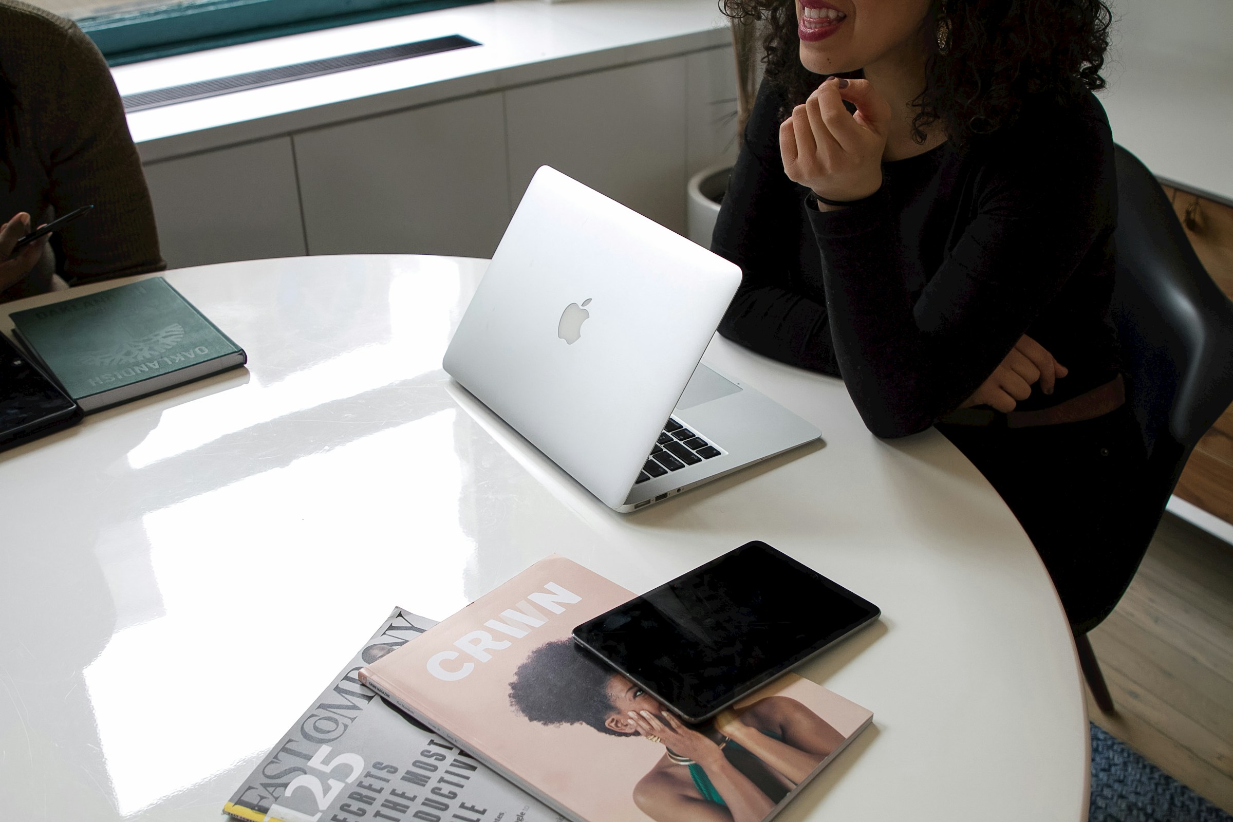 woman sitting - How Long Is a Resume Supposed to Be